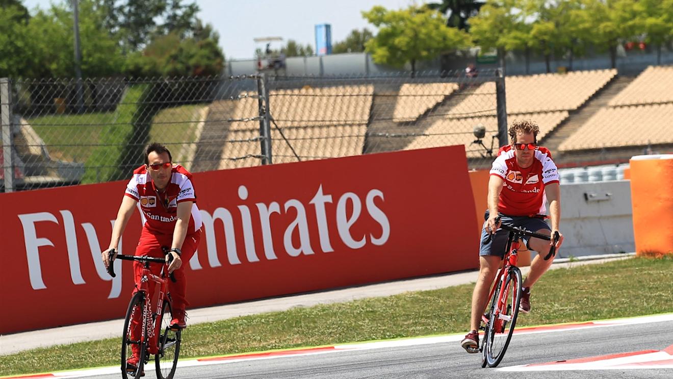 Sebastian Vettel (GER) Ferrari rides a bike on the track at Formula One World Championship, Rd5, Spanish Grand Prix Preparations, Barcelona, Spain, Thursday 7 May 2015. © Sutton Motorsport Images