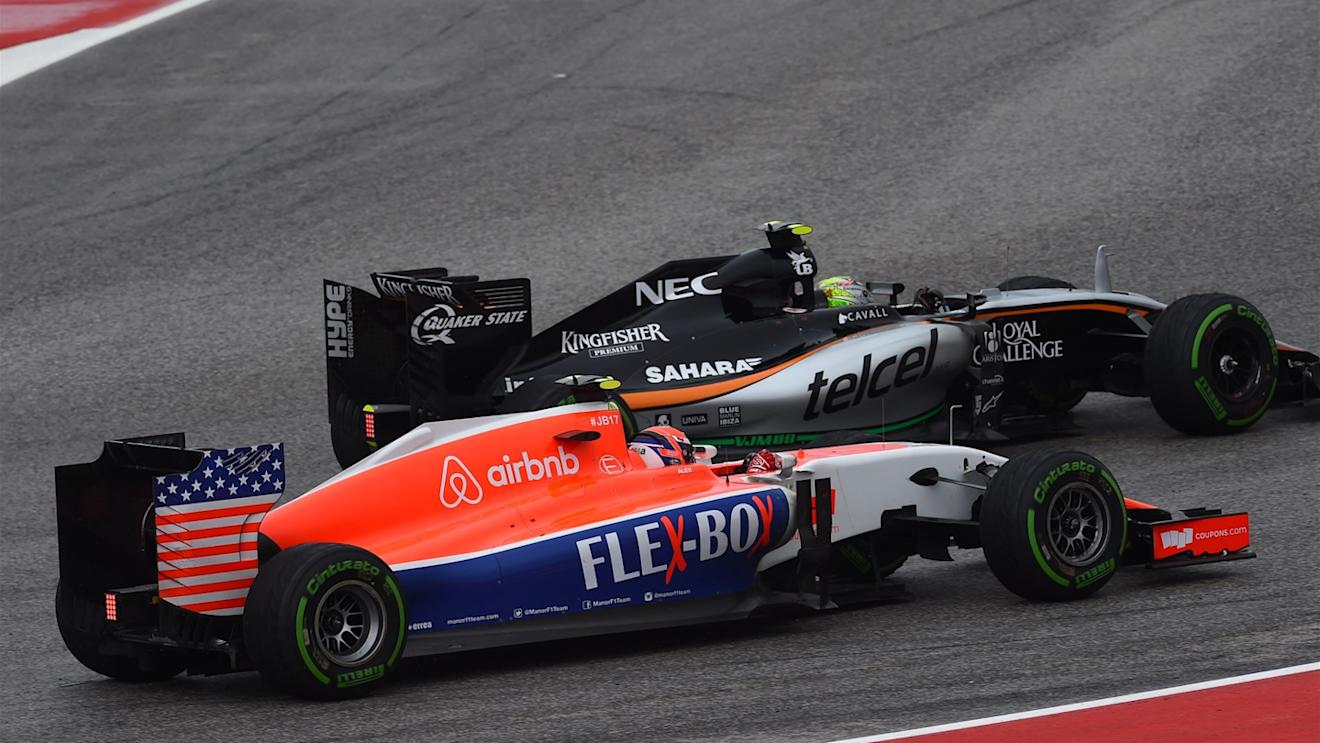 Alexander Rossi (USA) Marussia and Sergio Perez (MEX) Force India VJM08 battle at Formula One World Championship, Rd16, United States  Grand Prix, Race, Austin, Texas, USA, Sunday 25 October 2015. © Sutton Motorsport Images