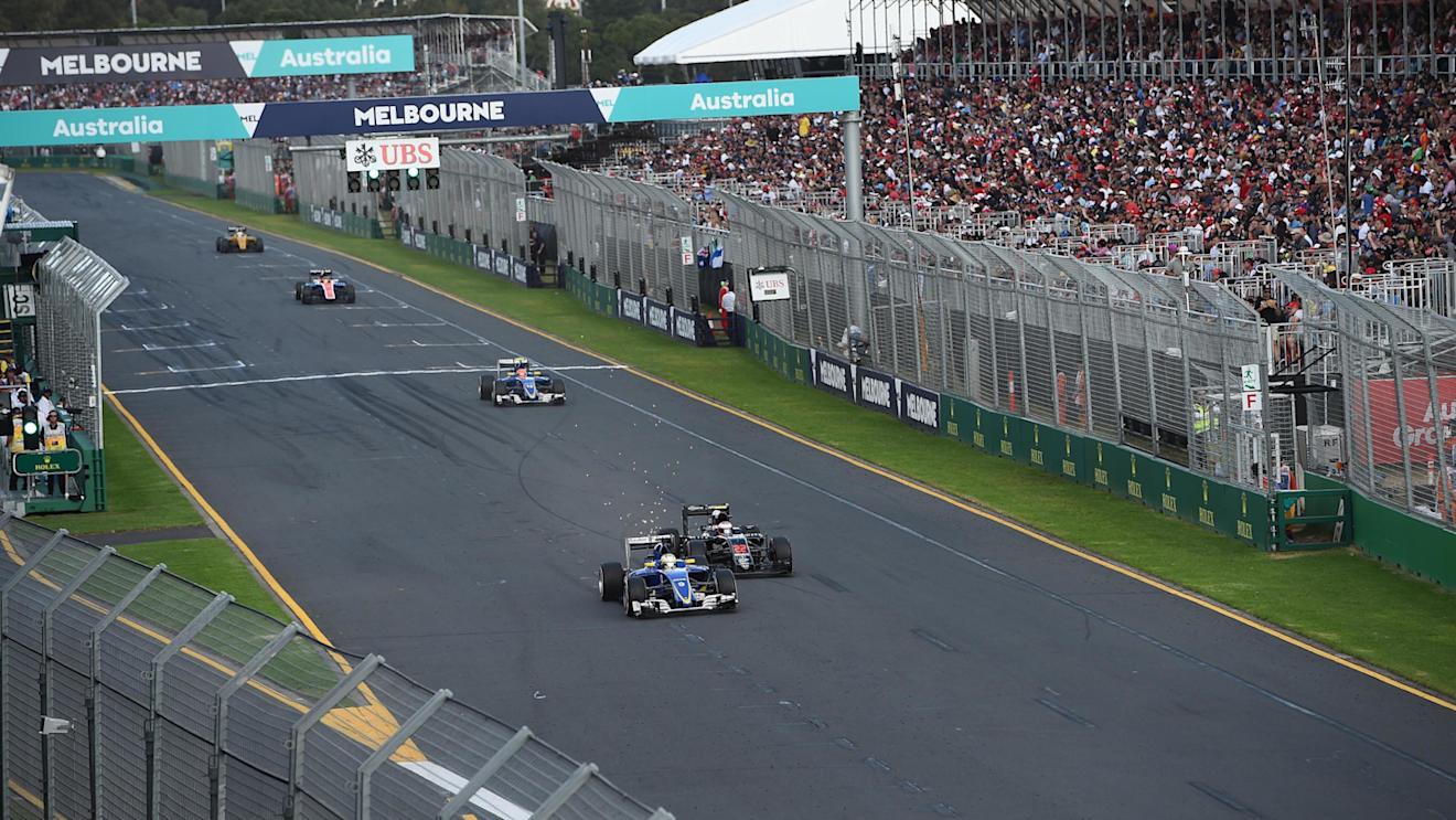 Marcus Ericsson (SWE) Sauber C35 Jenson Button (GBR) McLaren MP4-31 battle and at Formula One World Championship, Rd1, Australian Grand Prix, Race, Albert Park, Melbourne, Australia, Sunday 20 March 2016. © Sutton Motorsport Images