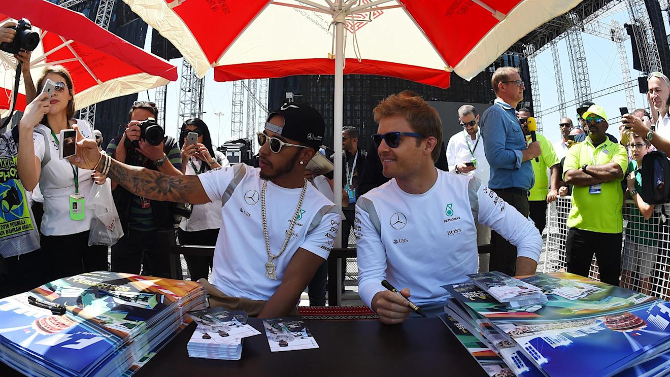 Lewis Hamilton (GBR) Mercedes AMG F1 and Nico Rosberg (GER) Mercedes AMG F1 pose for a selfie at the autograph session at Formula One World Championship, Rd2, Bahrain Grand Prix Qualifying, Bahrain International Circuit, Sakhir, Bahrain, Saturday 2 April 2016. © Sutton Motorsport Images