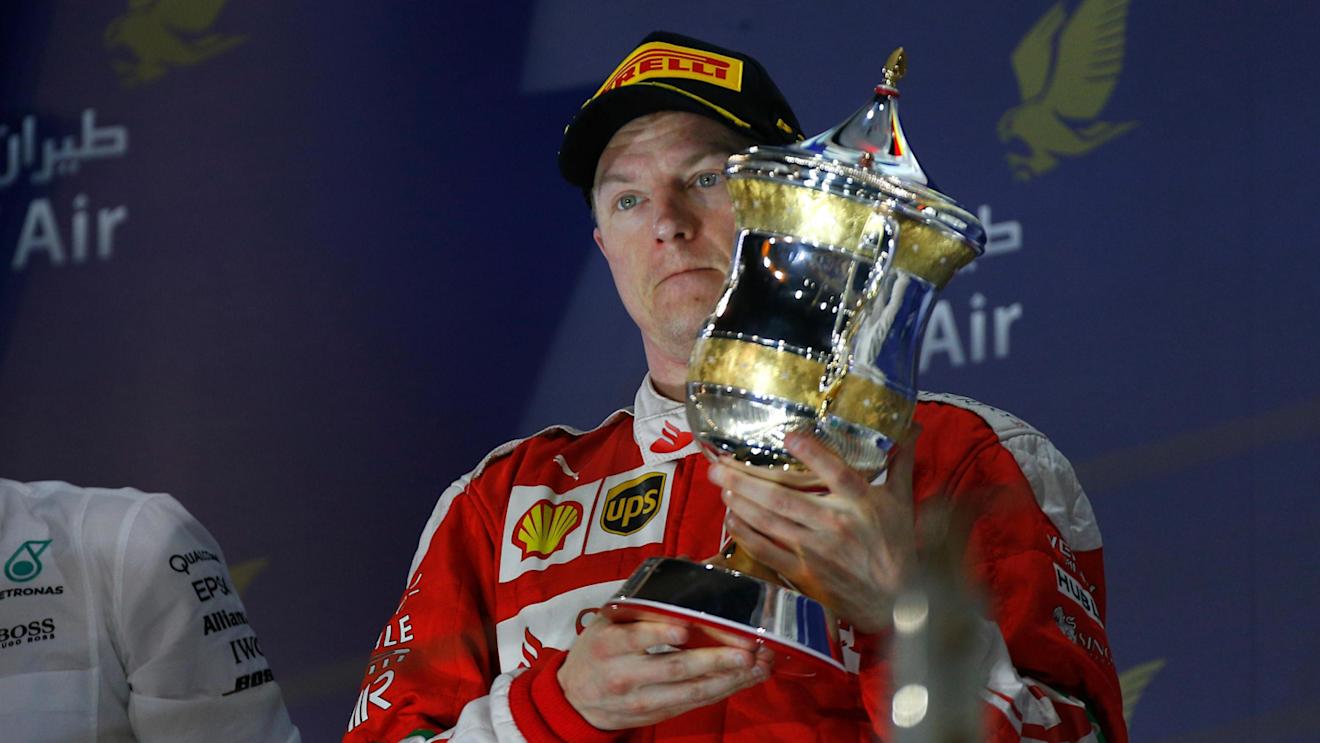 Kimi Raikkonen (FIN) Ferrari celebrates on the podium with the trophy at Formula One World Championship, Rd2, Bahrain Grand Prix Race, Bahrain International Circuit, Sakhir, Bahrain, Sunday 3 April 2016. © Sutton Motorsport Images