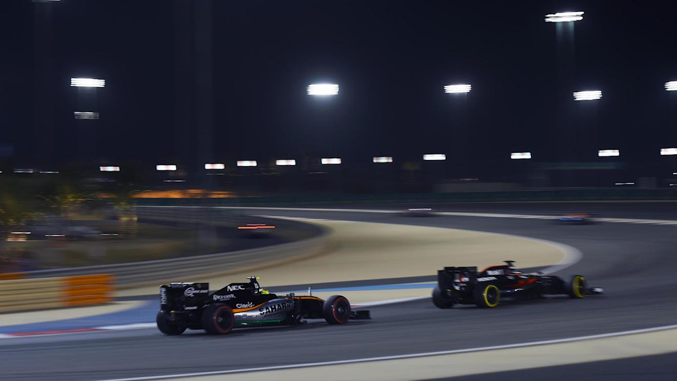 Stoffel Vandoorne (BEL) McLaren MP4-31 and Sergio Perez (MEX) Force India VJM09 at Formula One World Championship, Rd2, Bahrain Grand Prix Race, Bahrain International Circuit, Sakhir, Bahrain, Sunday 3 April 2016. © Sutton Motorsport Images