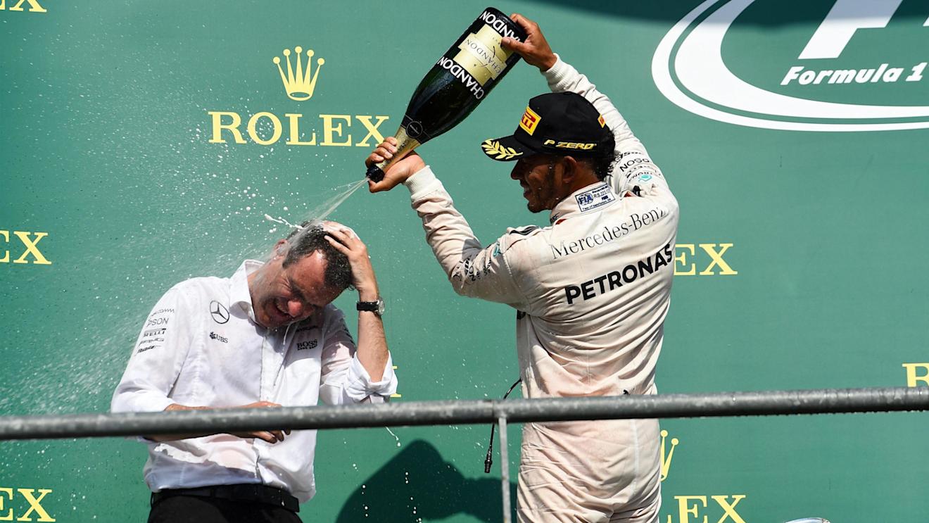Hywel Thomas (GBR) Mercedes AMG F1 and Lewis Hamilton (GBR) Mercedes AMG F1 celebrate on the podium with the champagne at Formula One World Championship, Rd13, Belgian Grand Prix, Race, Spa Francorchamps, Belgium, Sunday 28 August 2016. © Sutton Images