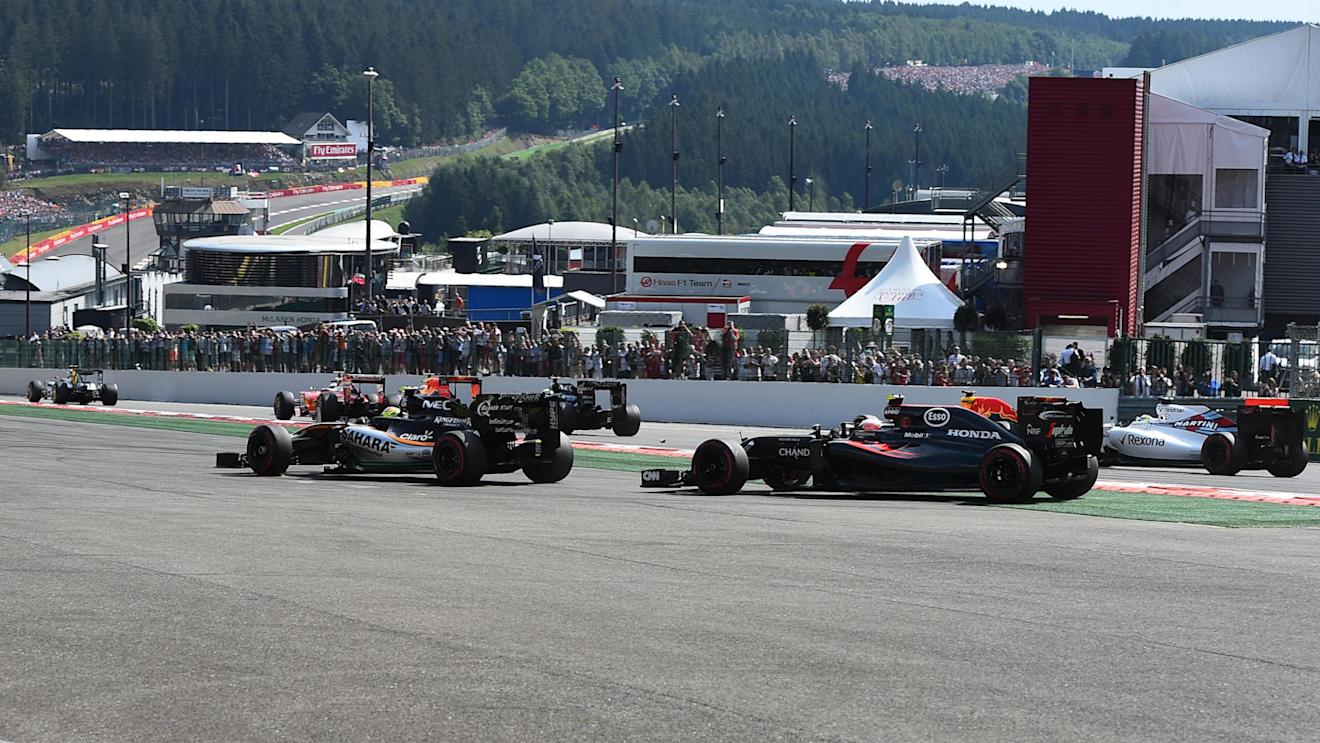 Sergio Perez (MEX) Force India VJM09 and Jenson Button (GBR) McLaren MP4-31 run wide at the start of the race at Formula One World Championship, Rd13, Belgian Grand Prix, Race, Spa Francorchamps, Belgium, Sunday 28 August 2016. © Sutton Images