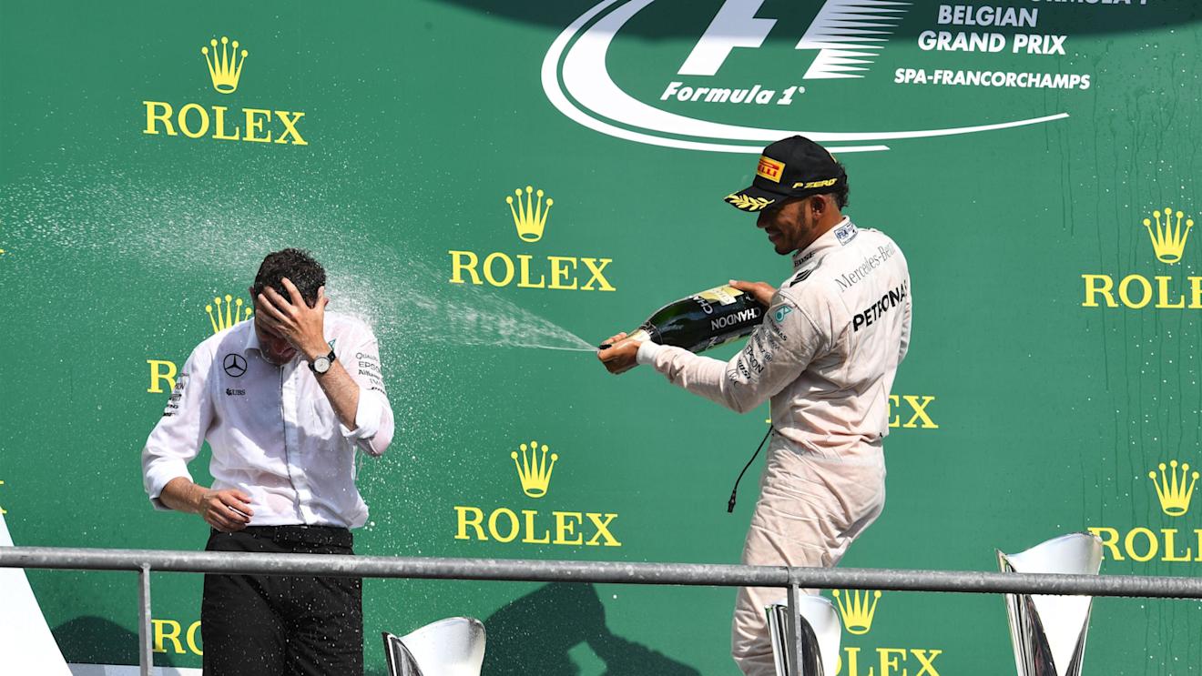 Lewis Hamilton (GBR) Mercedes AMG F1 and Hywel Thomas (GBR) Mercedes AMG F1 celebrate on the podium with the champagne at Formula One World Championship, Rd13, Belgian Grand Prix, Race, Spa Francorchamps, Belgium, Sunday 28 August 2016. © Sutton Images