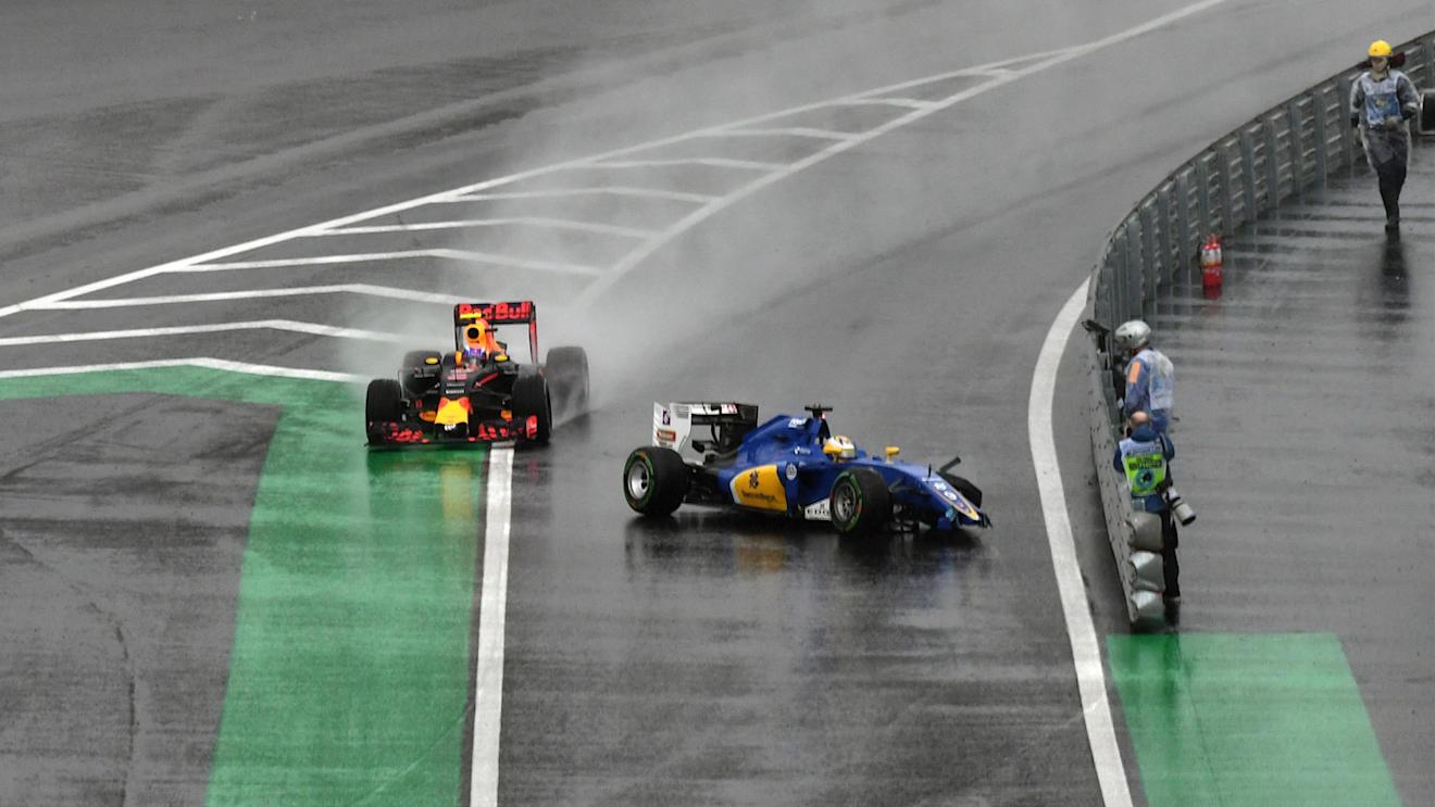 Marcus Ericsson (SWE) Sauber C35 crashes and is passed by Max Verstappen (NED) Red Bull Racing RB12 in pit lane entrance at Formula One World Championship, Rd20, Brazilian Grand Prix, Race, Interlagos, Sao Paulo, Brazil, Sunday 13 November 2016. © Sutton Images