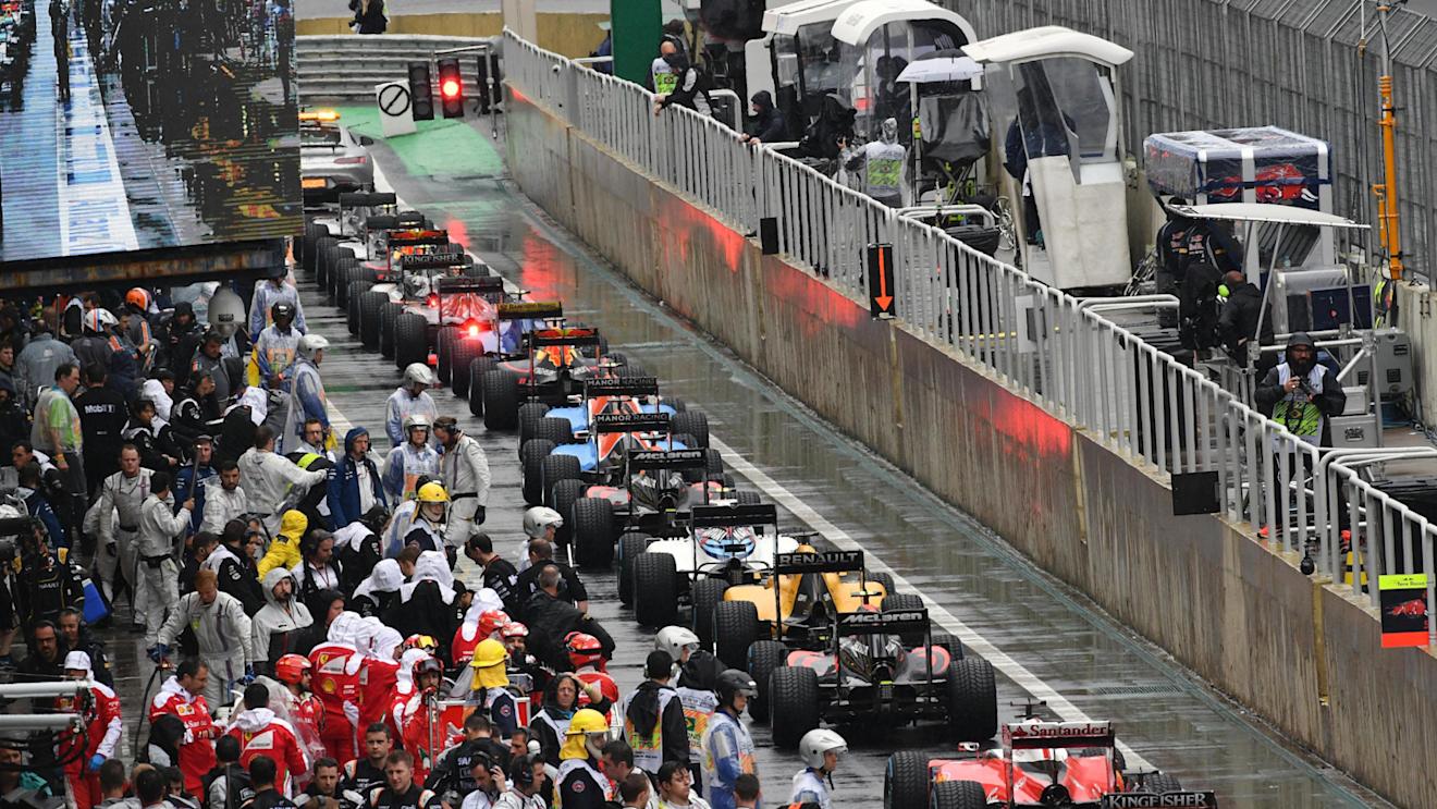 Cars in pit lane after the race suspension at Formula One World Championship, Rd20, Brazilian Grand Prix, Race, Interlagos, Sao Paulo, Brazil, Sunday 13 November 2016. © Sutton Images