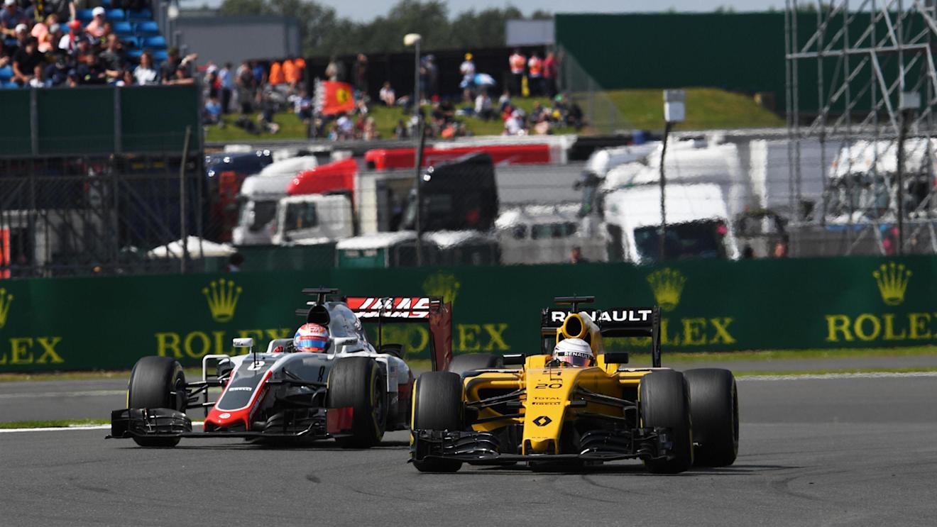 Romain Grosjean (FRA) Haas VF-16 and Kevin Magnussen (DEN) Renault Sport F1 Team RS16 at Formula One World Championship, Rd10, British Grand Prix, Practice, Silverstone, England, Friday 8 July 2016. © Sutton Images