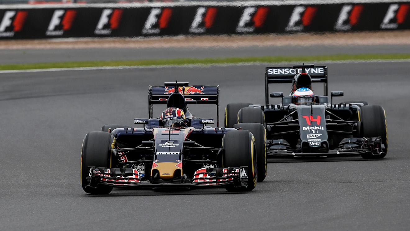 Daniil Kvyat (RUS) Scuderia Toro Rosso STR11 and Fernando Alonso (ESP) McLaren MP4-31 at Formula One World Championship, Rd10, British Grand Prix, Qualifying, Silverstone, England, Saturday 9 July 2016. © Sutton Images