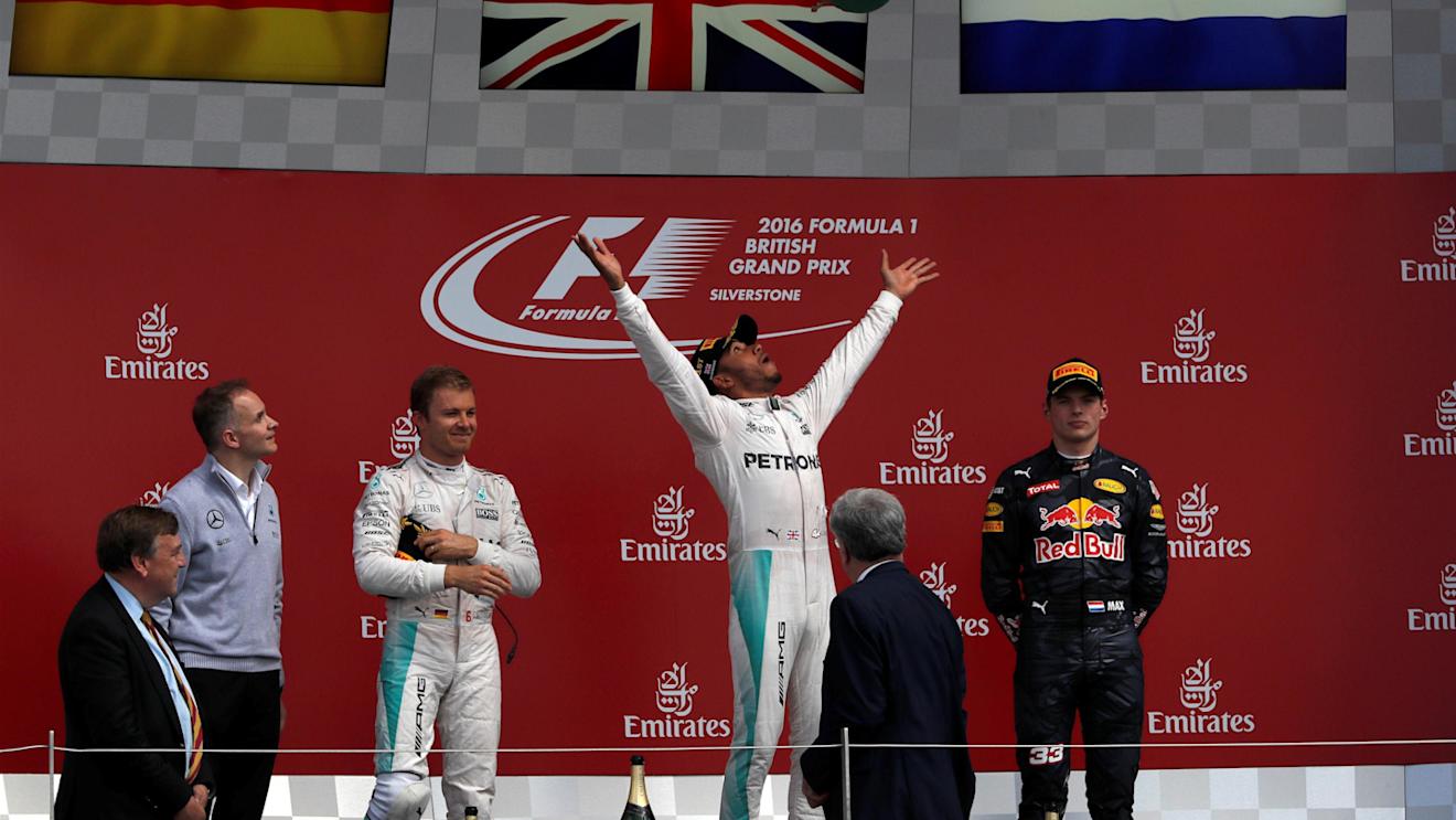 John Owen (GBR) Mercedes AMG F1 Chief Designer, Nico Rosberg (GER) Mercedes AMG F1, Race winner Lewis Hamilton (GBR) Mercedes AMG F1 and Max Verstappen (NED) Red Bull Racing celebrate on the podium with the trophy at Formula One World Championship, Rd10, British Grand Prix, Race, Silverstone, England, Sunday 10 July 2016. © Sutton Images