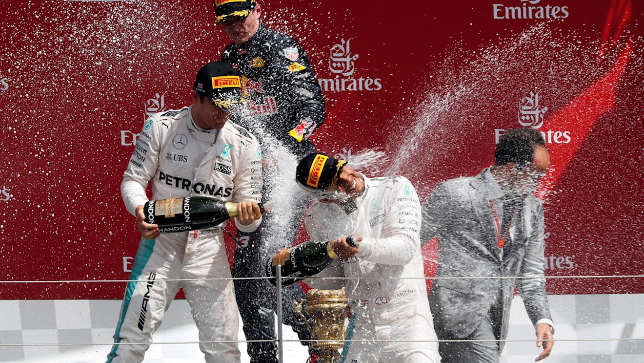 Nico Rosberg (GER) Mercedes AMG F1, Race winner Lewis Hamilton (GBR) Mercedes AMG F1 and Max Verstappen (NED) Red Bull Racing celebrate on the podium with the champagne at Formula One World Championship, Rd10, British Grand Prix, Race, Silverstone, England, Sunday 10 July 2016. © Sutton Images