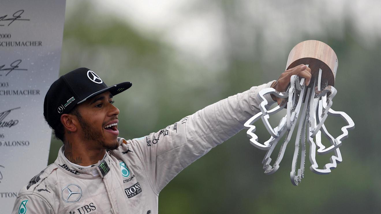 Race winner Lewis Hamilton (GBR) Mercedes AMG F1 celebrates on the podium with the trophy at Formula One World Championship, Rd7, Canadian Grand Prix, Race, Montreal, Canada, Sunday 12 June 2016. © Sutton Images
