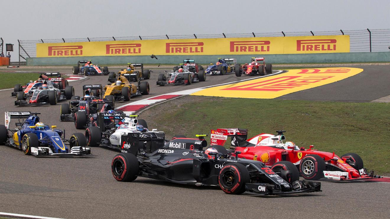 Jenson Button (GBR) McLaren MP4-31 and Sebastian Vettel (GER) Ferrari SF16-H at the start of the race at Formula One World Championship, Rd3, Chinese Grand Prix, Race, Shanghai, China, Sunday 17 April 2016. © Sutton Motorsport Images