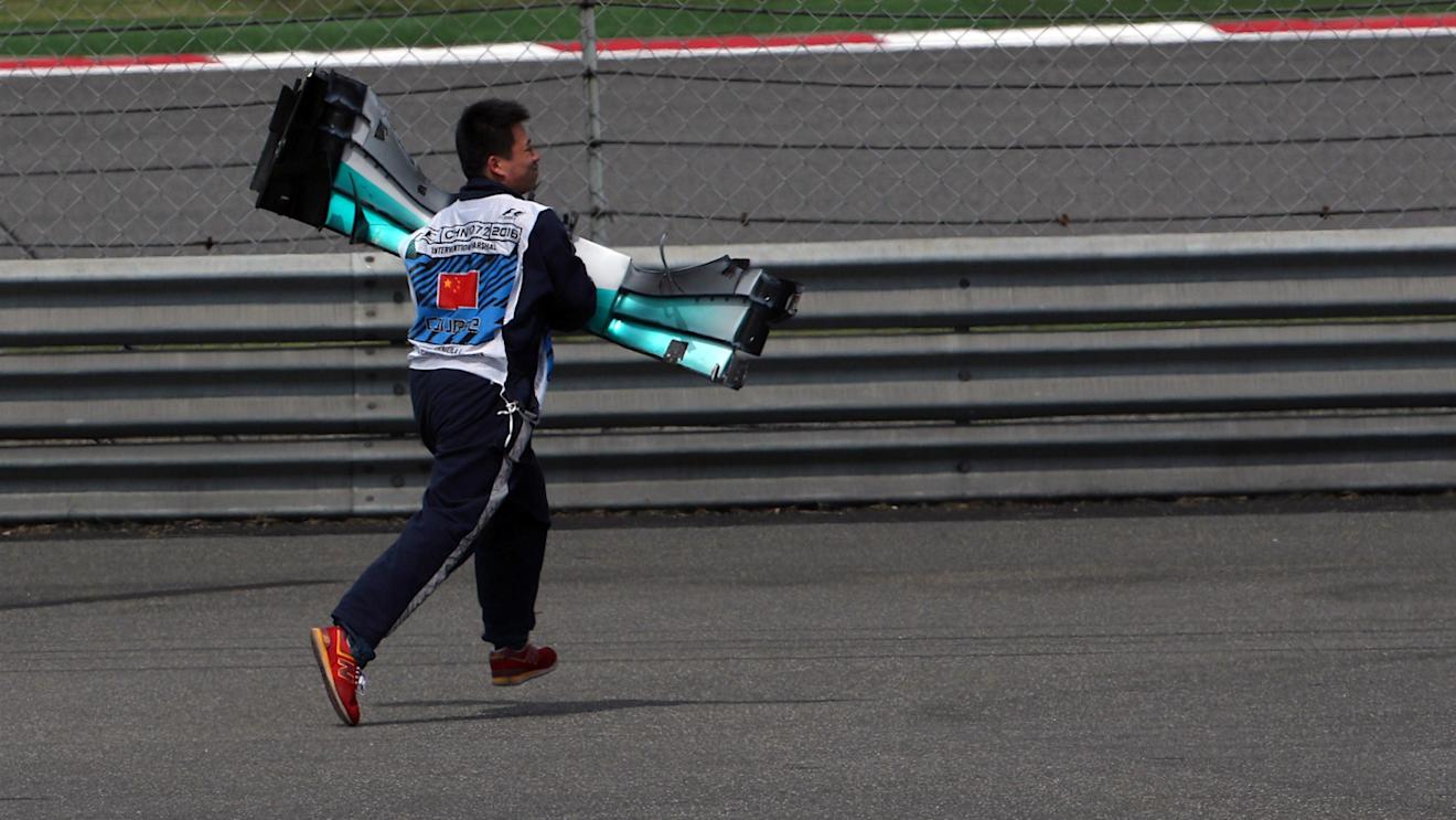 Marshal collects the damaged front wing of Lewis Hamilton (GBR) Mercedes-Benz F1 W07 Hybrid at Formula One World Championship, Rd3, Chinese Grand Prix, Race, Shanghai, China, Sunday 17 April 2016. © Sutton Motorsport Images