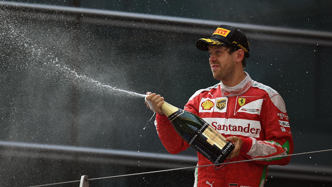 Sebastian Vettel (GER) Ferrari celebrates with the champagne on the podium at Formula One World Championship, Rd3, Chinese Grand Prix, Race, Shanghai, China, Sunday 17 April 2016. © Sutton Motorsport Images