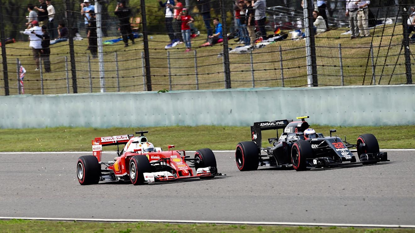 Sebastian Vettel (GER) Ferrari SF16-H and Jenson Button (GBR) McLaren MP4-31 battle at Formula One World Championship, Rd3, Chinese Grand Prix, Race, Shanghai, China, Sunday 17 April 2016. © Sutton Motorsport Images