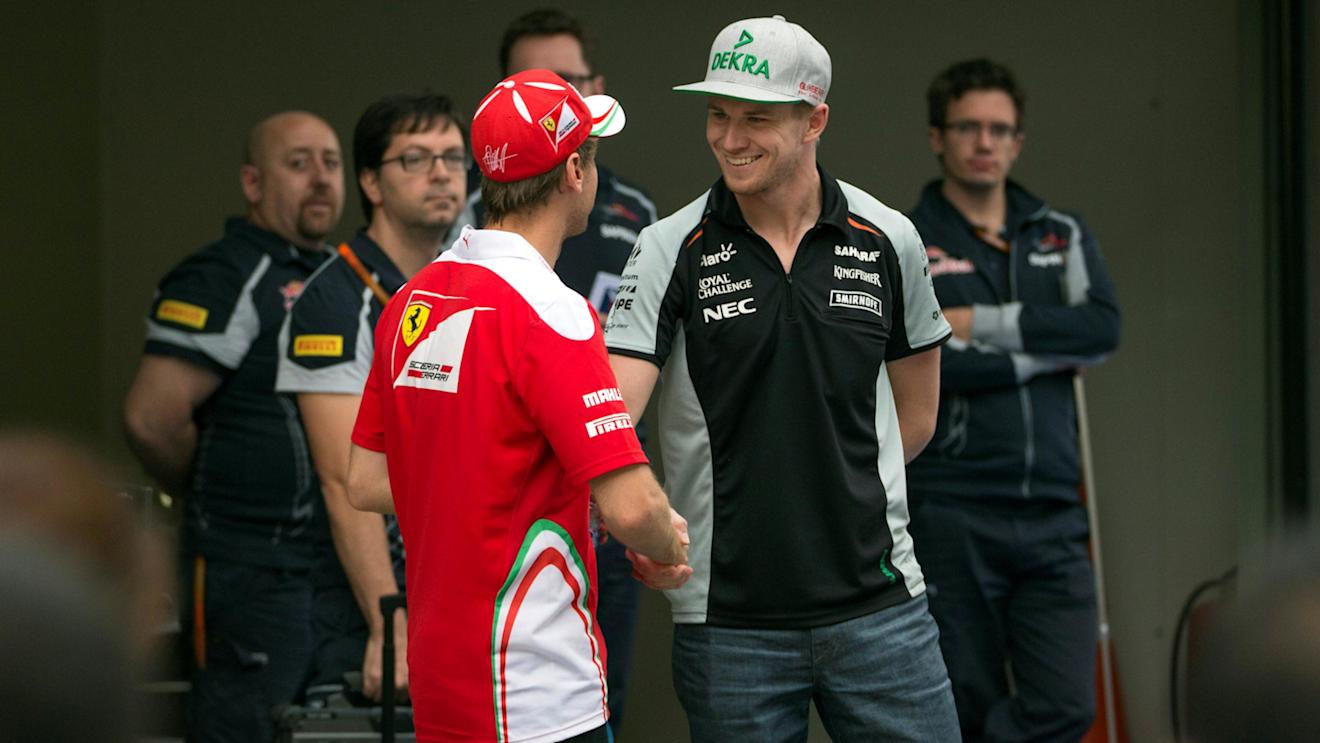 Nico Hulkenberg (GER) Force India F1 and Sebastian Vettel (GER) Ferrari at Formula One World Championship, Rd3, Chinese Grand Prix, Preparations, Shanghai, China, Thursday 14 April 2016. © Sutton Motorsport Images