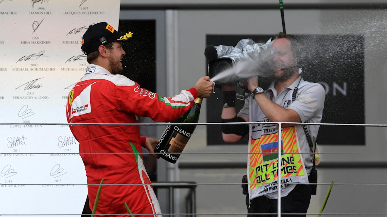 Sebastian Vettel (GER) Ferrari celebrates on the podium with the champagne at Formula One World Championship, Rd8, European Grand Prix, Race, Baku City Circuit, Baku, Azerbaijan, Sunday 19 June 2016. © Sutton Images