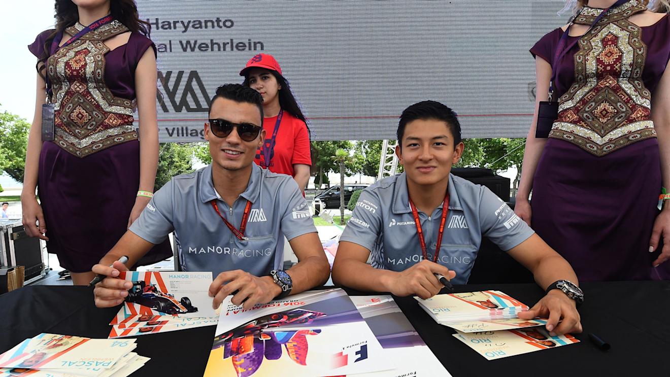 Pascal Wehrlein (GER) Manor Racing and Rio Haryanto (IDN) Manor Racing at the autograph session at Formula One World Championship, Rd8, European Grand Prix, Race, Baku City Circuit, Baku, Azerbaijan, Sunday 19 June 2016. © Sutton Images