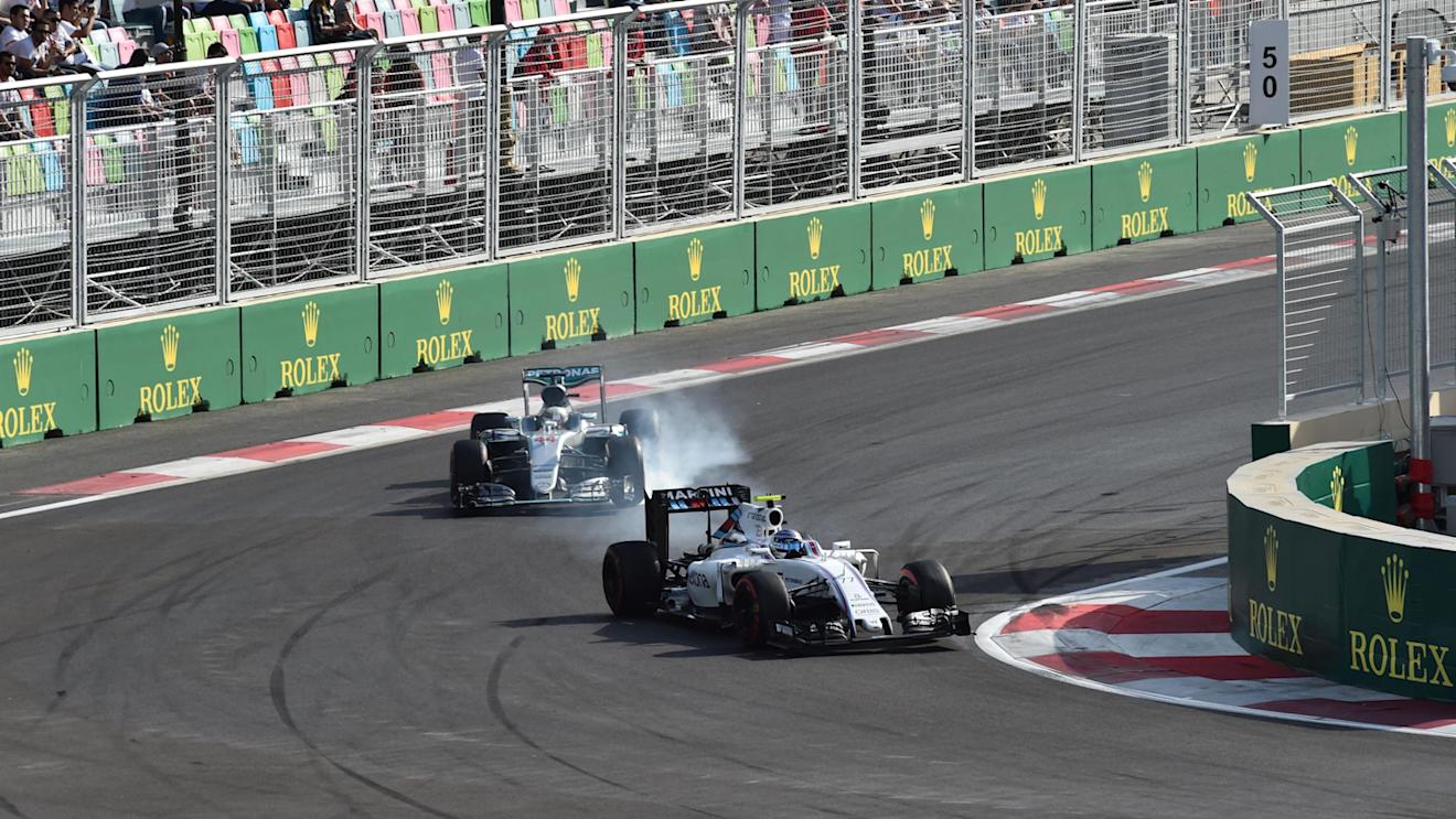 Valtteri Bottas (FIN) Williams FW38 locks up and Lewis Hamilton (GBR) Mercedes-Benz F1 W07 Hybrid at Formula One World Championship, Rd8, European Grand Prix, Race, Baku City Circuit, Baku, Azerbaijan, Sunday 19 June 2016. © Sutton Images