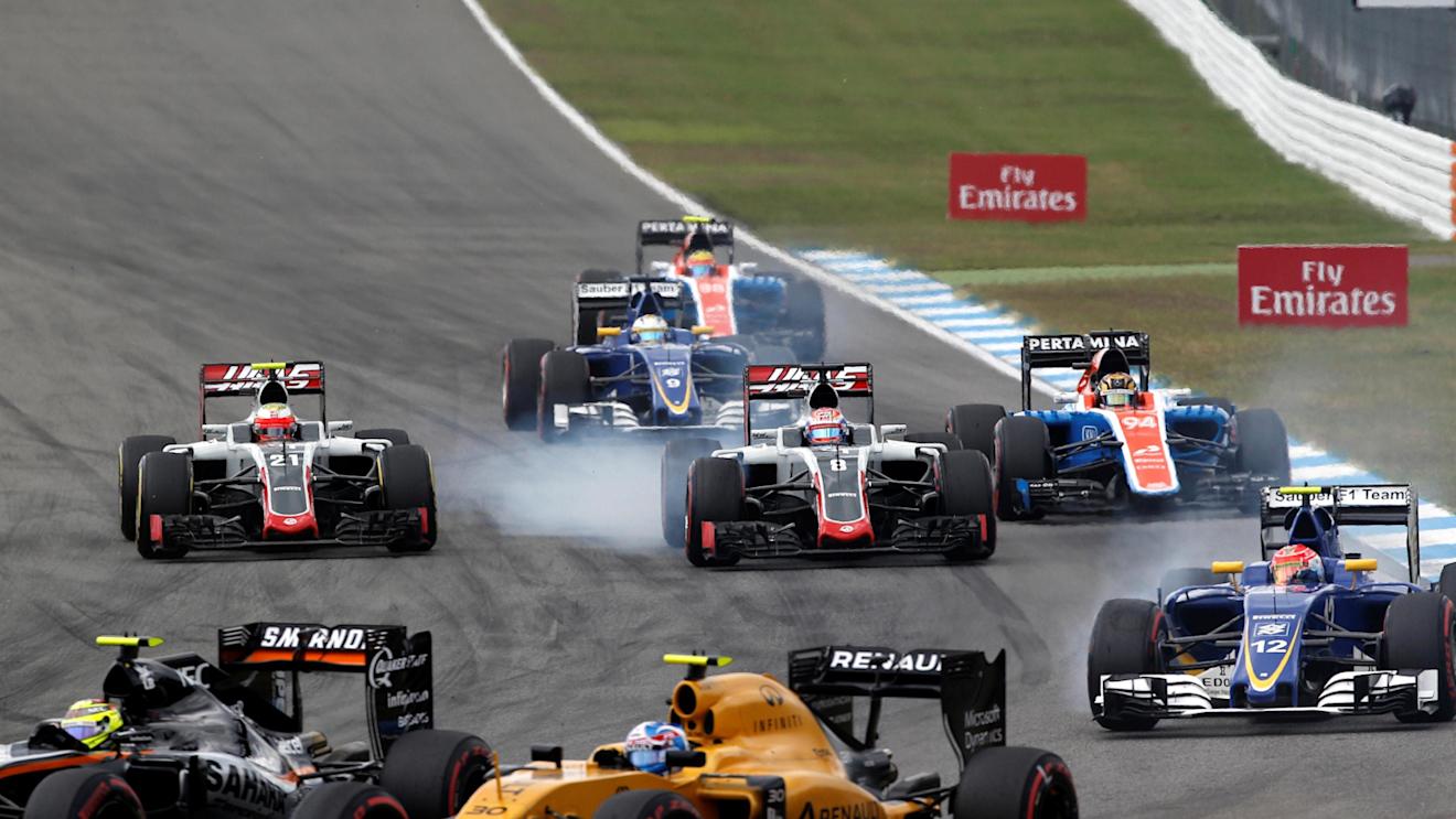 Esteban Gutierrez (MEX) Haas VF-16 and Romain Grosjean (FRA) Haas VF-16 lock up and battle for position at the start of the race at Formula One World Championship, Rd12, German Grand Prix, Race, Hockenheim, Germany, Sunday 31 July 2016. © Sutton Images