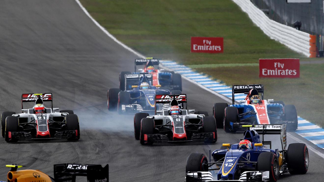 Esteban Gutierrez (MEX) Haas VF-16, Romain Grosjean (FRA) Haas VF-16 and Pascal Wehrlein (GER) Manor Racing MRT05 battle at Formula One World Championship, Rd12, German Grand Prix, Race, Hockenheim, Germany, Sunday 31 July 2016. © Sutton Images