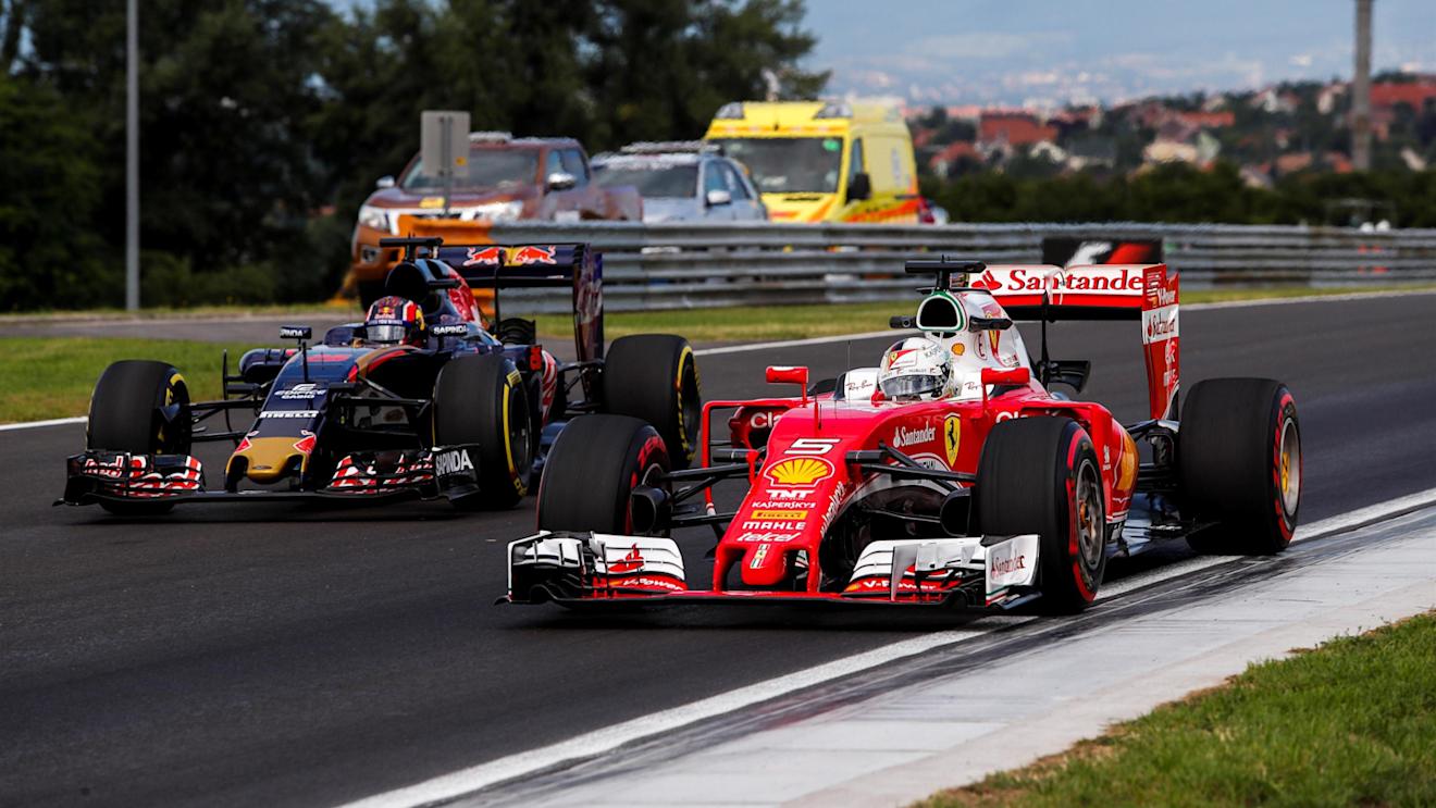Sebastian Vettel (GER) Ferrari SF16-H and Daniil Kvyat (RUS) Scuderia Toro Rosso STR11 at Formula One World Championship, Rd11, Practice, Hungaroring, Hungary, Friday 22 July 2016. © Sutton Images