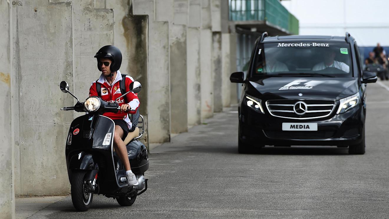 Sebastian Vettel (GER) Ferrari arrives at the track on a scooter at Formula One World Championship, Rd11, Practice, Hungaroring, Hungary, Friday 22 July 2016. © Sutton Images