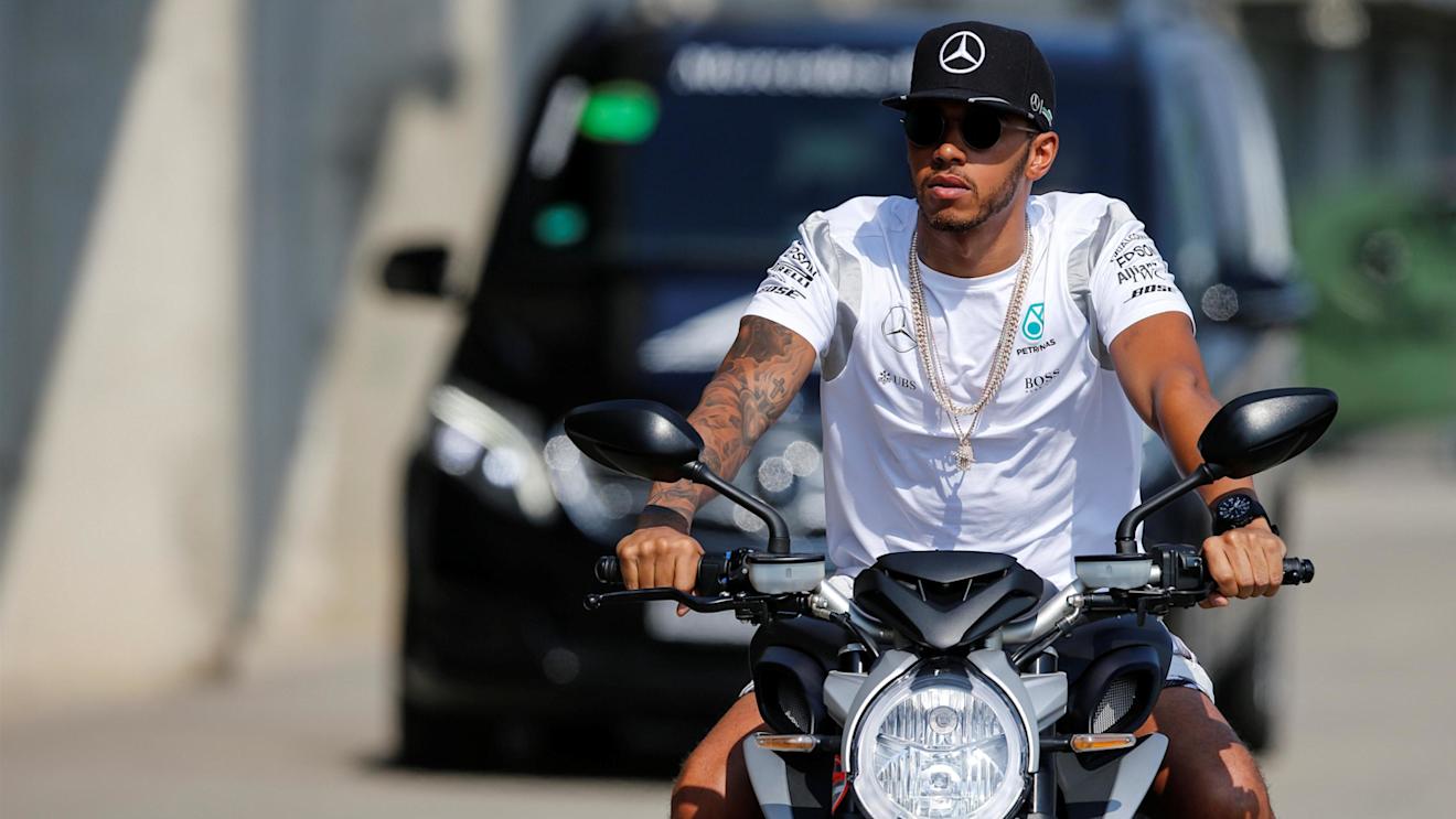 Lewis Hamilton (GBR) Mercedes AMG F1 arrives at the track on a motorbike at Formula One World Championship, Rd11, Qualifying, Hungaroring, Hungary, Saturday 23 July 2016. © Sutton Images