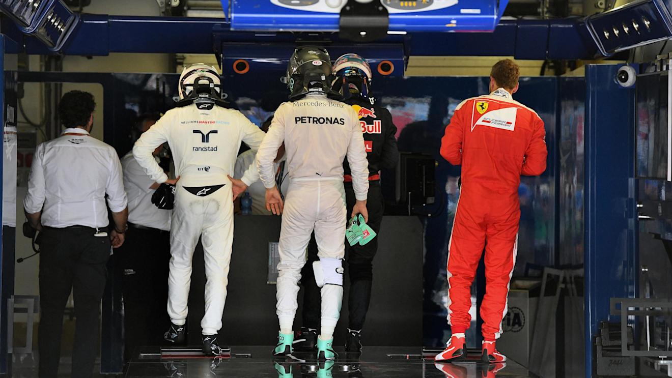 Valtteri Bottas (FIN) Williams, Nico Rosberg (GER) Mercedes AMG F1 and Sebastian Vettel (GER) Ferrari in parc ferme at Formula One World Championship, Rd11, Hungarian Grand Prix, Qualifying, Hungaroring, Hungary, Saturday 23 July 2016. © Sutton Images