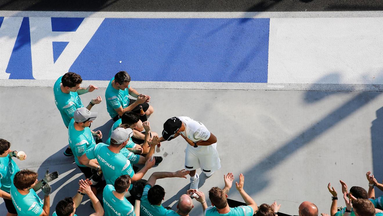 Race winner Lewis Hamilton (GBR) Mercedes AMG F1 celebrates with the team at Formula One World Championship, Rd11, Hungarian Grand Prix, Race, Hungaroring, Hungary, Sunday 24 July 2016. © Sutton Images