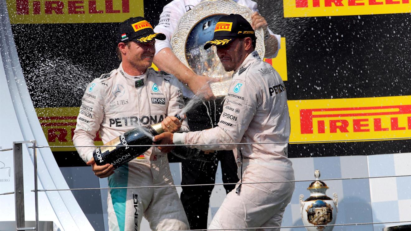 Ron Meadows (GBR) Mercedes AMG F1 Team Manager, Nico Rosberg (GER) Mercedes AMG F1 and race winner Lewis Hamilton (GBR) Mercedes AMG F1 celebrate on the podium with the champagne at Formula One World Championship, Rd11, Hungarian Grand Prix, Race, Hungaroring, Hungary, Sunday 24 July 2016. © Sutton Images
