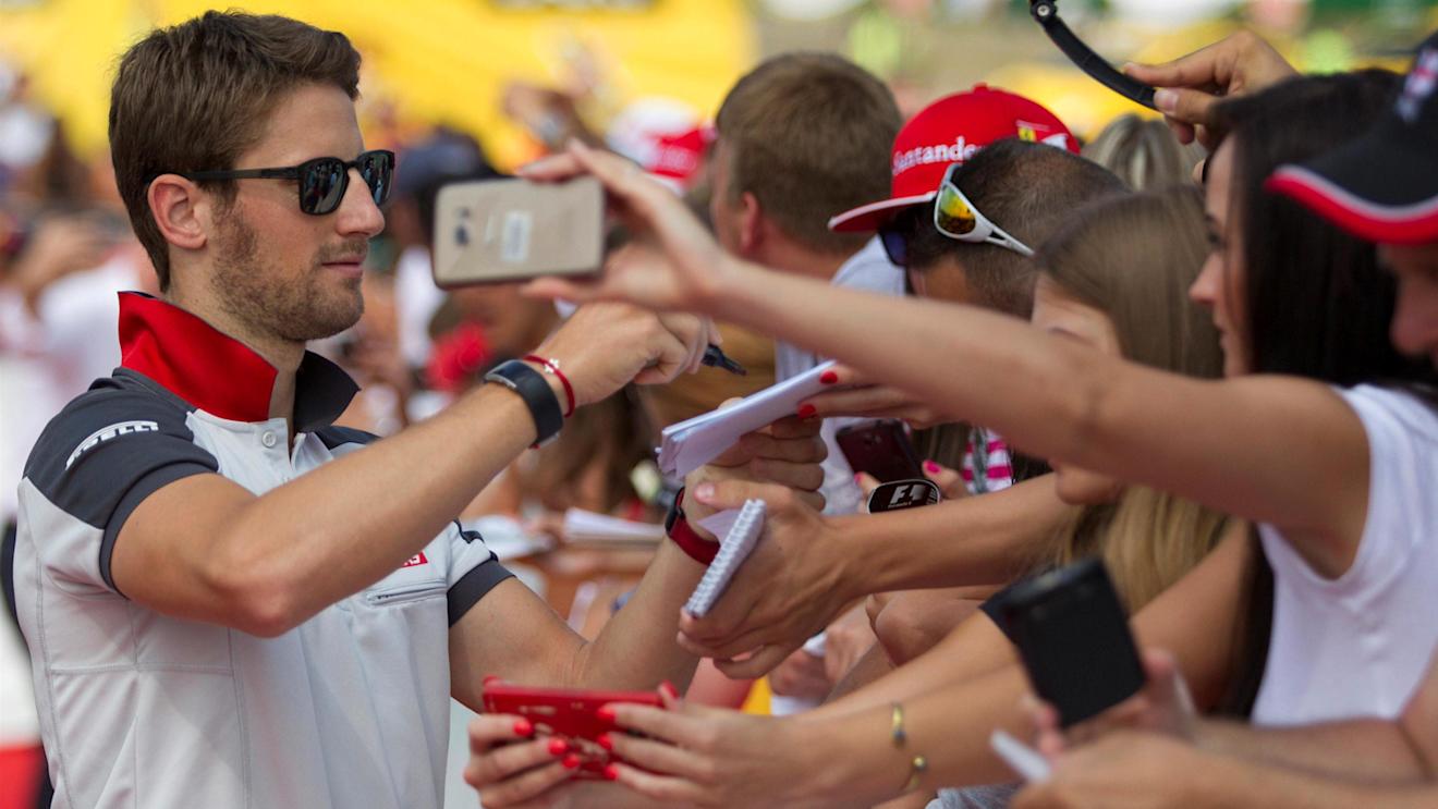 Romain Grosjean (FRA) Haas F1 signs autographs for the fans at Formula One World Championship, Rd11, Hungarian Grand Prix, Race, Hungaroring, Hungary, Sunday 24 July 2016. © Sutton Images