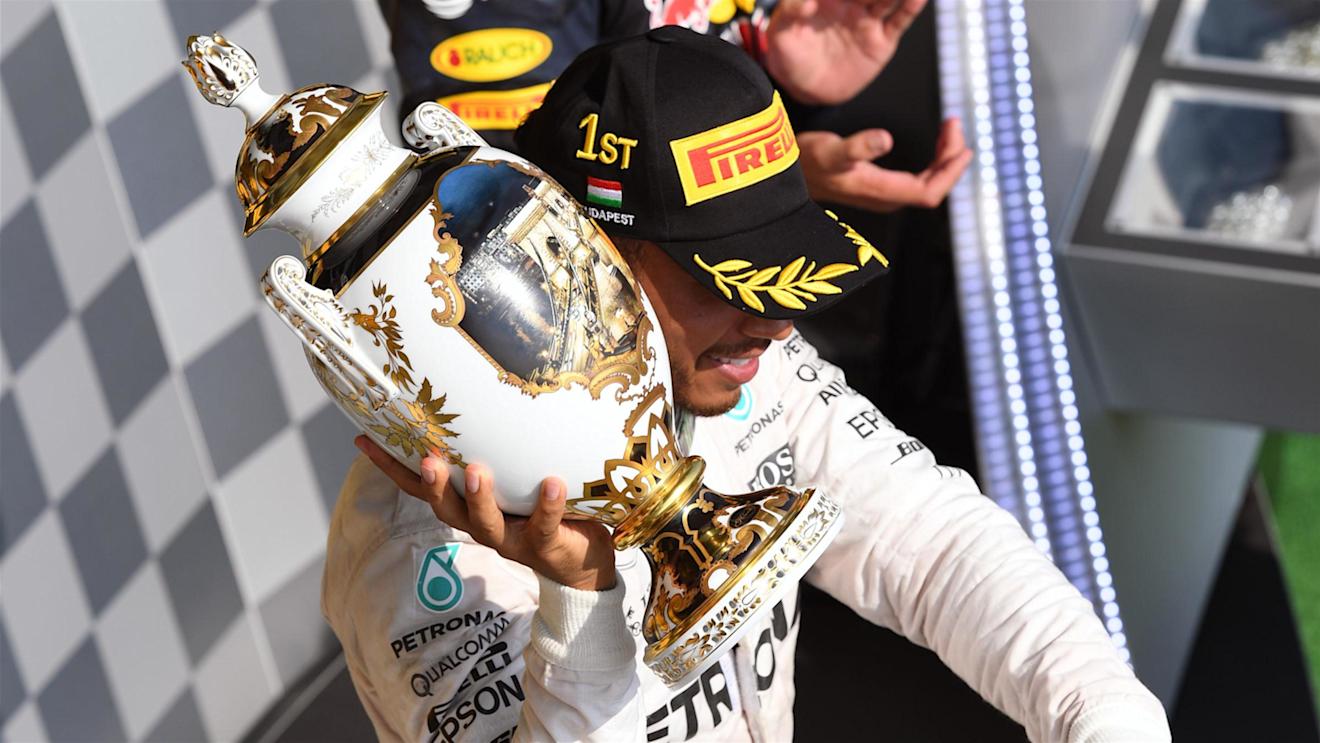 Race winner Lewis Hamilton (GBR) Mercedes AMG F1 celebrates on the podium with the trophy at Formula One World Championship, Rd11, Hungarian Grand Prix, Race, Hungaroring, Hungary, Sunday 24 July 2016. © Sutton Images