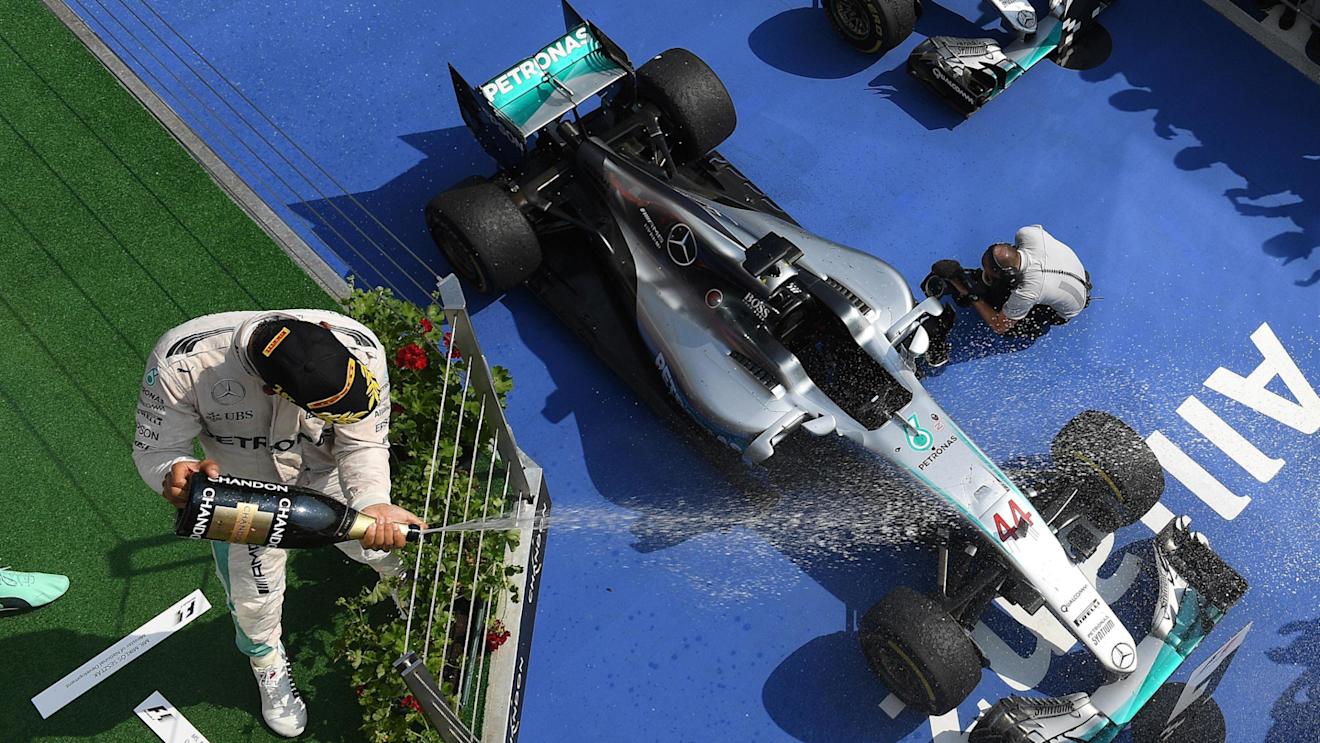 Race winner Lewis Hamilton (GBR) Mercedes AMG F1 celebrates on the podium with the champagne at Formula One World Championship, Rd11, Hungarian Grand Prix, Race, Hungaroring, Hungary, Sunday 24 July 2016. © Sutton Images