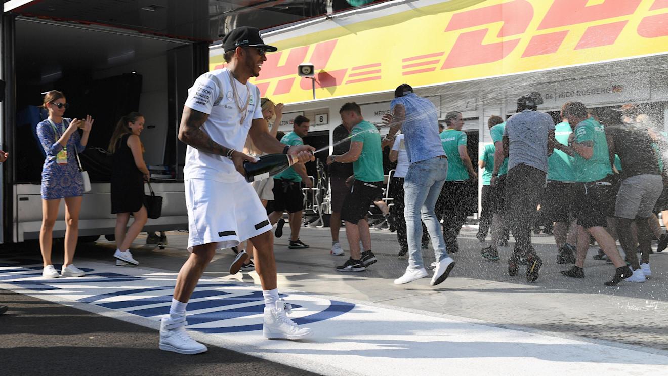 Race winner Lewis Hamilton (GBR) Mercedes AMG F1 celebrates with the champagne at Formula One World Championship, Rd11, Hungarian Grand Prix, Race, Hungaroring, Hungary, Sunday 24 July 2016. © Sutton Images