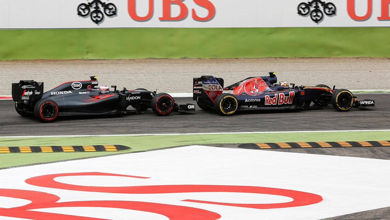 Jenson Button (GBR) McLaren MP4-31 and Carlos Sainz (ESP) Scuderia Toro Rosso STR11 battle at Formula One World Championship, Rd14, Italian Grand Prix, Race, Monza, Italy, Sunday 4 September 2016. © Sutton Images