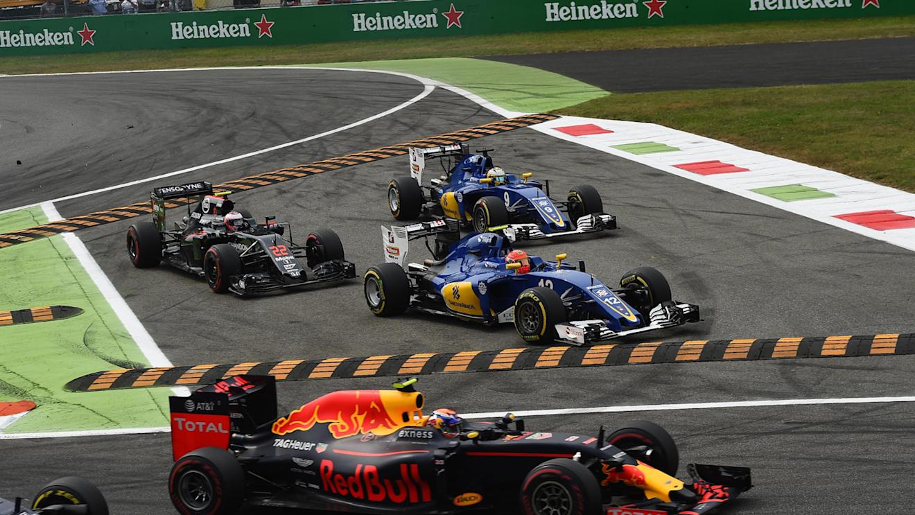 Jenson Button (GBR) McLaren MP4-31, Marcus Ericsson (SWE) Sauber C35 and Felipe Nasr (BRA) Sauber C35 run wide at the start of the race at Formula One World Championship, Rd14, Italian Grand Prix, Race, Monza, Italy, Sunday 4 September 2016. © Sutton Images
