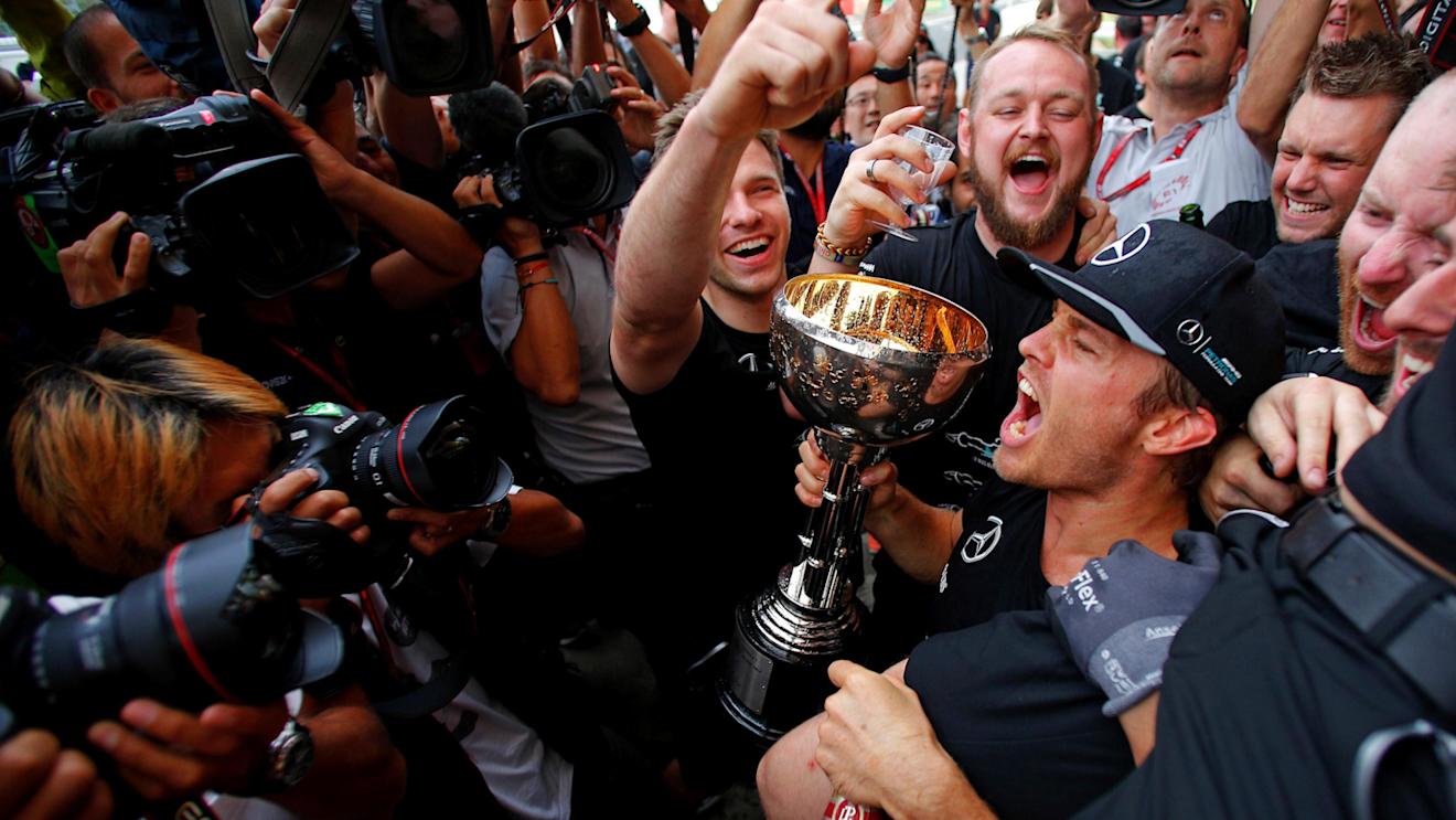 Nico Rosberg (GER) Mercedes AMG F1 celebrates the constructors championship with the team and the trophy at Formula One World Championship, Rd17, Japanese Grand Prix, Race, Suzuka, Japan, Sunday 9 October 2016. © Sutton Images
