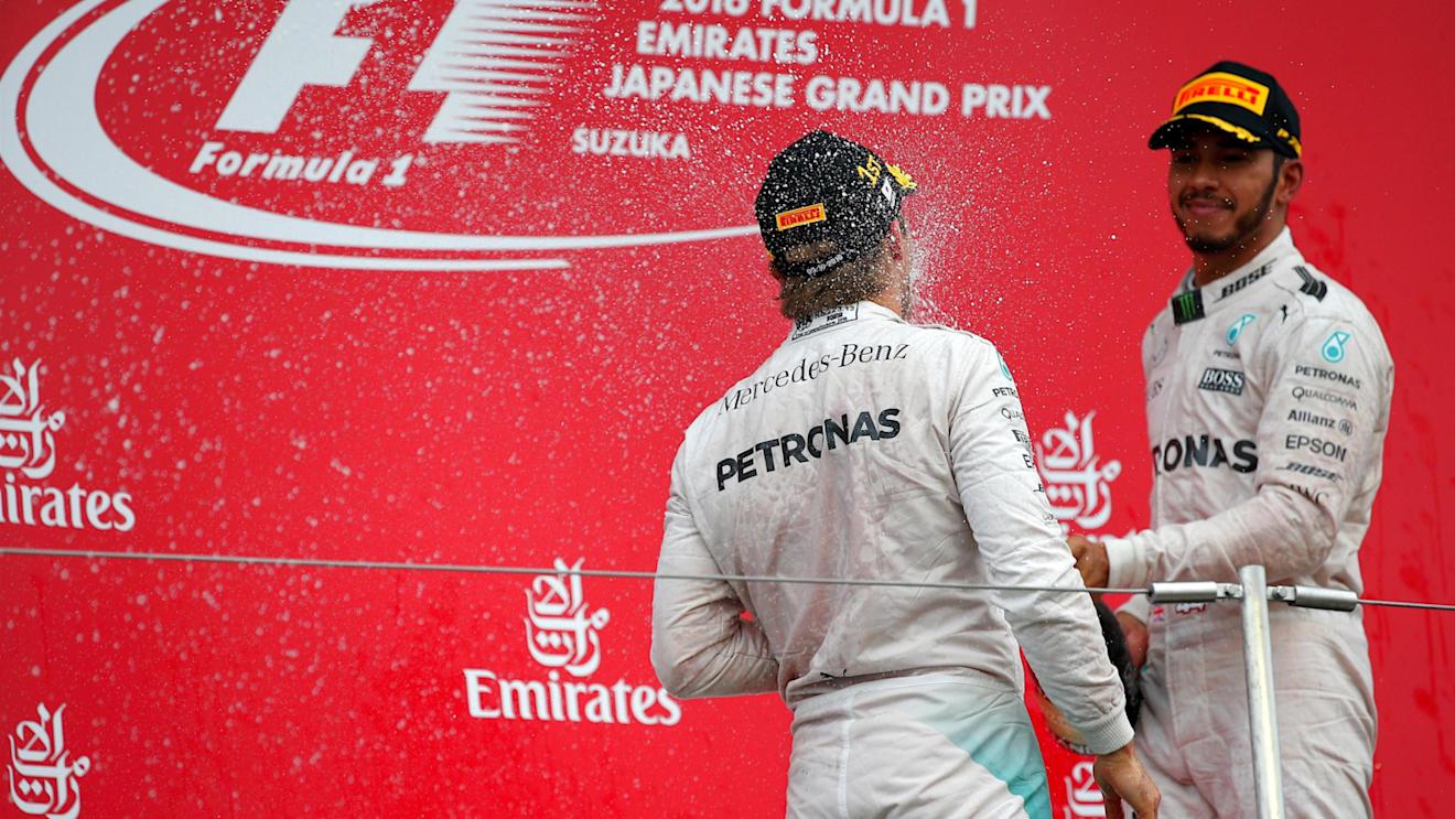 Race winner Nico Rosberg (GER) Mercedes AMG F1 and Lewis Hamilton (GBR) Mercedes AMG F1 celebrate on the podium with the champagne at Formula One World Championship, Rd17, Japanese Grand Prix, Race, Suzuka, Japan, Sunday 9 October 2016. © Sutton Images