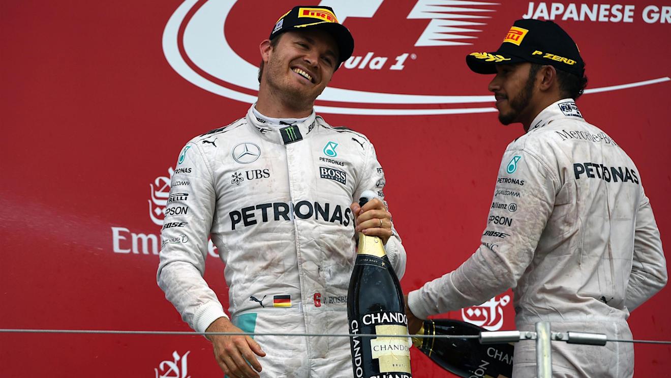Race winner Nico Rosberg (GER) Mercedes AMG F1 and Lewis Hamilton (GBR) Mercedes AMG F1 celebrate on the podium with the champagne at Formula One World Championship, Rd17, Japanese Grand Prix, Race, Suzuka, Japan, Sunday 9 October 2016. © Sutton Images