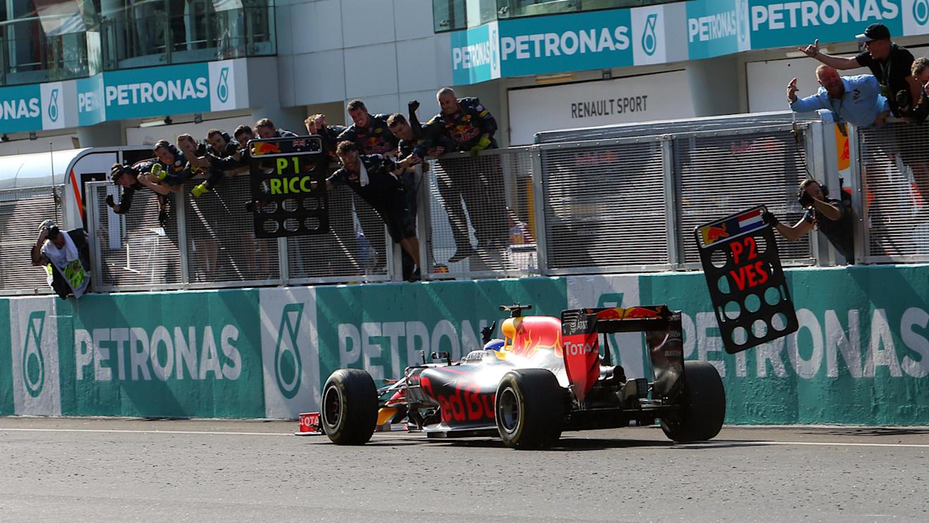 Race winner Daniel Ricciardo (AUS) Red Bull Racing RB12 crosses the line to win the race and celebrate with the team on the pitwall at Formula One World Championship, Rd16, Malaysian Grand Prix, Race,  Sepang, Malaysia, Sunday 2 October 2016. © Sutton Images