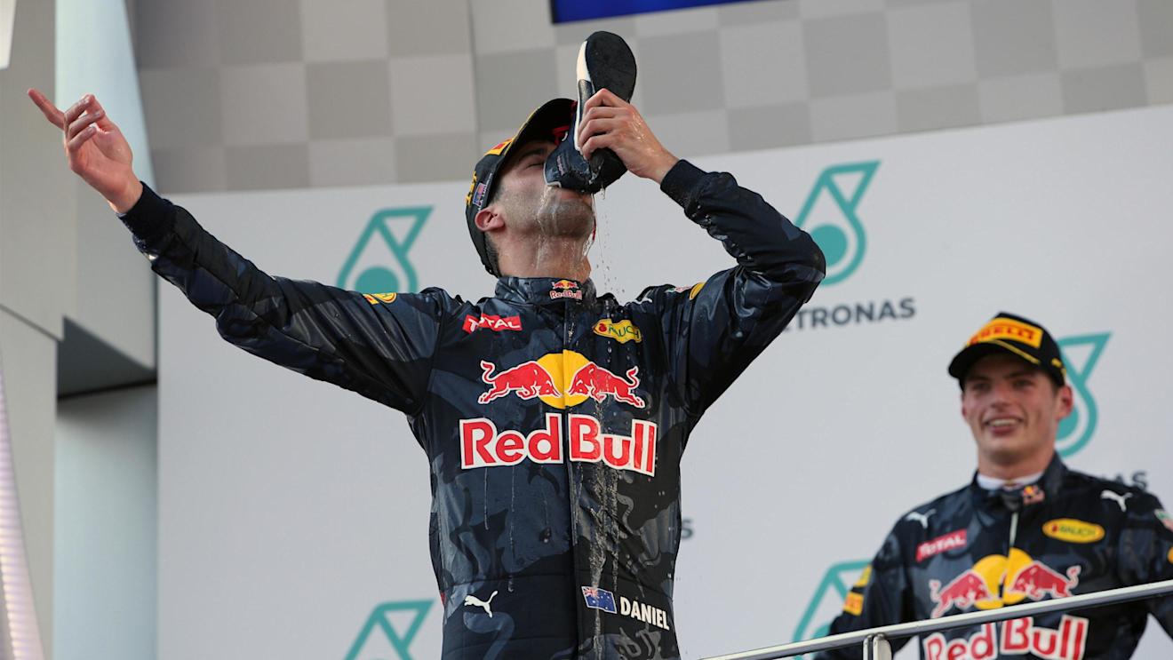 Race winner Daniel Ricciardo (AUS) Red Bull Racing celebrates on the podium and drinks champagne from a shoe at Formula One World Championship, Rd16, Malaysian Grand Prix, Race,  Sepang, Malaysia, Sunday 2 October 2016. © Sutton Images