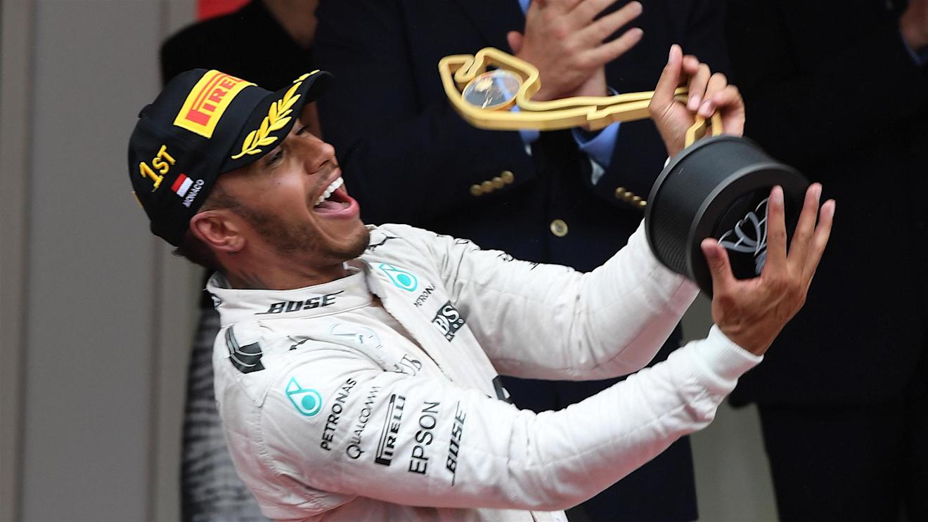 Lewis Hamilton (GBR) Mercedes AMG F1 celebrates with the trophy on the podium at Formula One World Championship, Rd6, Monaco Grand Prix, Race, Monte-Carlo, Monaco, Sunday 29 May 2016. © Sutton Images