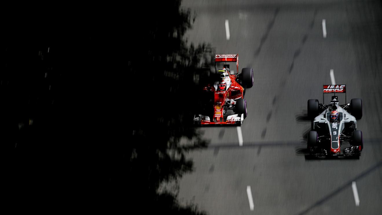 Kimi Raikkonen (FIN) Ferrari SF16-H and Romain Grosjean (FRA) Haas VF-16 at Formula One World Championship, Rd15, Singapore Grand Prix, Practice, Marina Bay Street Circuit, Singapore, Friday 16 September 2016. © Sutton Images