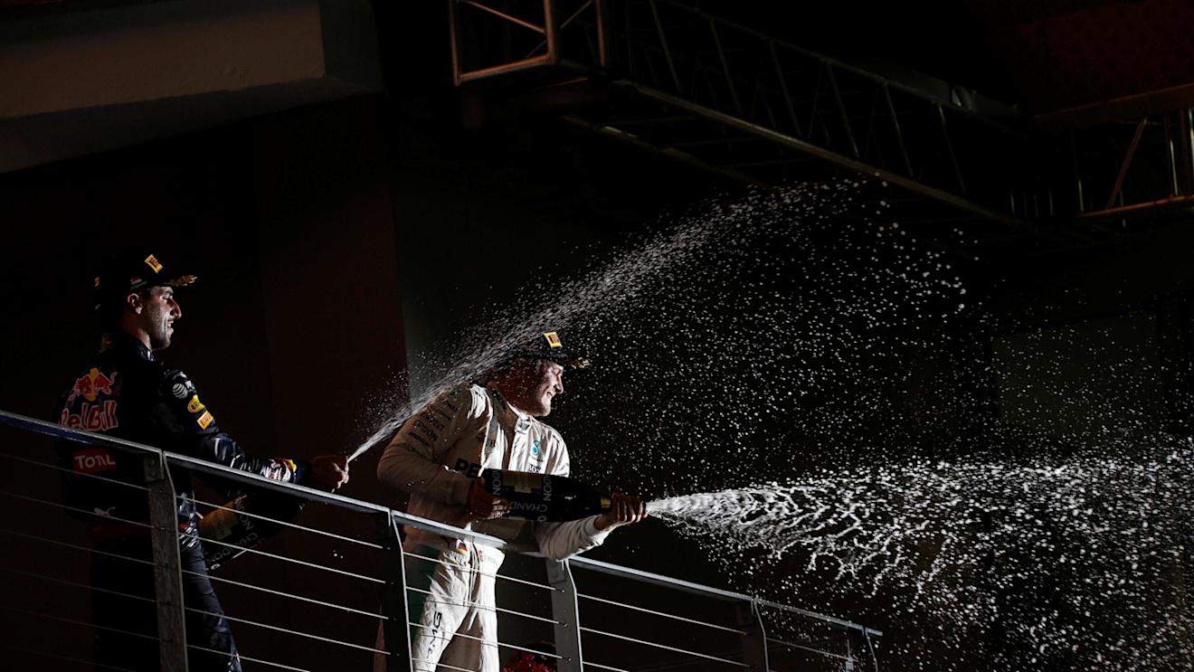 Daniel Ricciardo (AUS) Red Bull Racing and Race winner Nico Rosberg (GER) Mercedes AMG F1 celebrate on the podium with the champagne at Formula One World Championship, Rd15, Singapore Grand Prix, Race, Marina Bay Street Circuit, Singapore, Sunday 18 September 2016. © Sutton Images