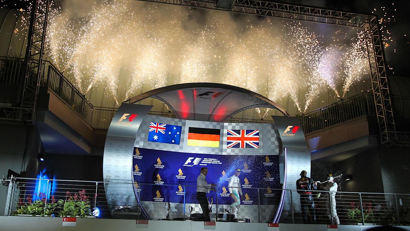 Mark Ellis (GBR) Mercedes AMG F1 Performance Director, Lewis Hamilton (GBR) Mercedes AMG F1, Daniel Ricciardo (AUS) Red Bull Racing and race winner Nico Rosberg (GER) Mercedes AMG F1 celebrate on the podium with the champagne at Formula One World Championship, Rd15, Singapore Grand Prix, Race, Marina Bay Street Circuit, Singapore, Sunday 18 September 2016. © Sutton Images