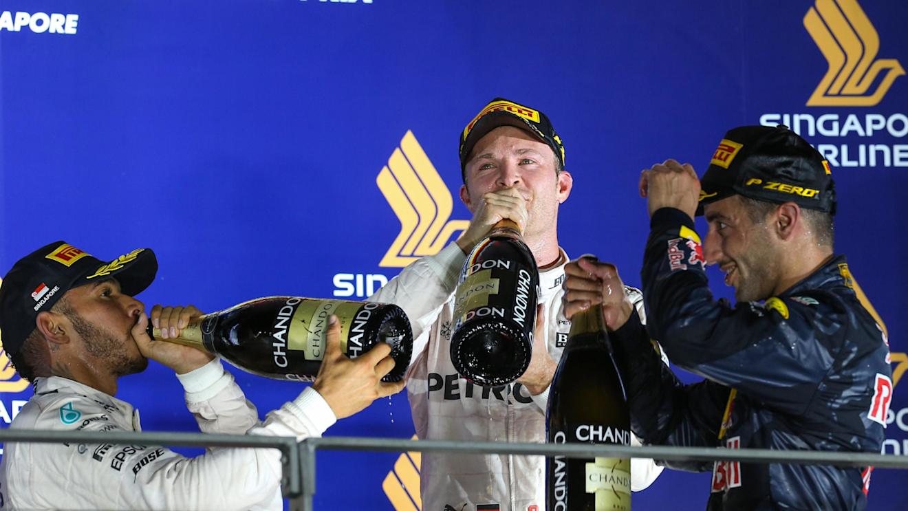 Lewis Hamilton (GBR) Mercedes AMG F1, race winner Nico Rosberg (GER) Mercedes AMG F1 and Daniel Ricciardo (AUS) Red Bull Racing celebrate on the podium with the champagne at Formula One World Championship, Rd15, Singapore Grand Prix, Race, Marina Bay Street Circuit, Singapore, Sunday 18 September 2016. © Sutton Images