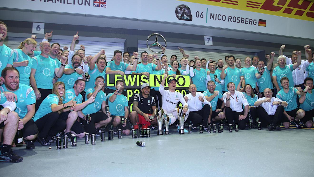 Race winner Nico Rosberg (GER) Mercedes AMG F1 and Lewis Hamilton (GBR) Mercedes AMG F1 celebrate with the team at Formula One World Championship, Rd15, Singapore Grand Prix, Race, Marina Bay Street Circuit, Singapore, Sunday 18 September 2016. © Sutton Images