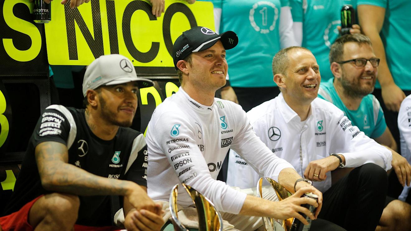 Lewis Hamilton (GBR) Mercedes AMG F1 and Nico Rosberg (GER) Mercedes AMG F1 celebrate with the team and the trophies at Formula One World Championship, Rd15, Singapore Grand Prix, Race, Marina Bay Street Circuit, Singapore, Sunday 18 September 2016. © Sutton Images